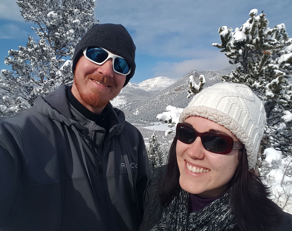 couple having fun things to do in estes park colorado in winter