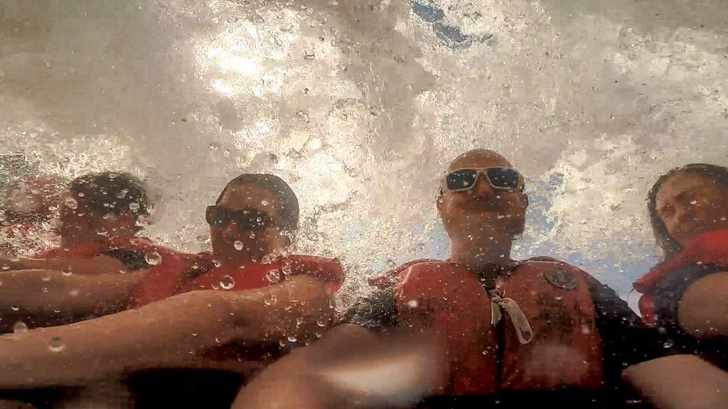 Huge wave of water crashing over us and the boat on our whirlpool jet boat tour