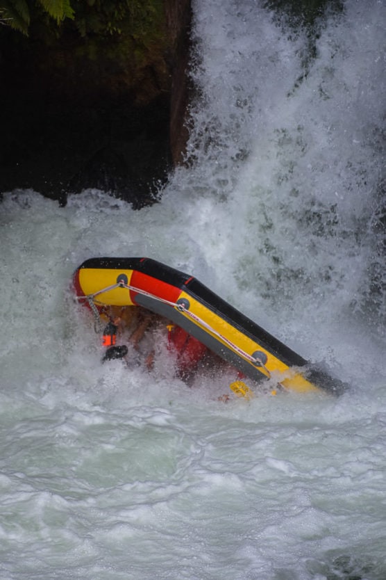 flipping over tutea falls on new zealand rafting trip with kaituna cascades